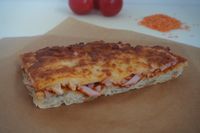 Pizza slice med skinke